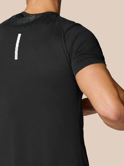 Back view of the black Flow Training Muscle Grip T-Shirt with a slim vertical reflective stripe down the back