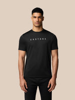 Male model wearing black Graphic Training T Shirt with crew neck Castore logo and AerTek sweat-wicking tech.