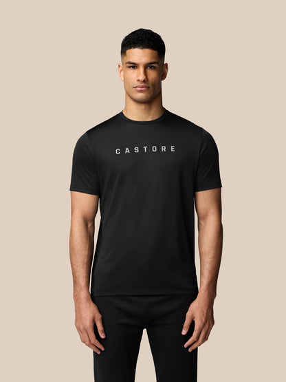 Male model wearing black Graphic Training T Shirt with crew neck Castore logo and AerTek sweat-wicking tech.