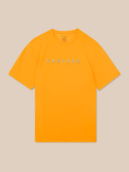 Mango orange graphic training T-shirt with bold CASTORE lettering across the chest