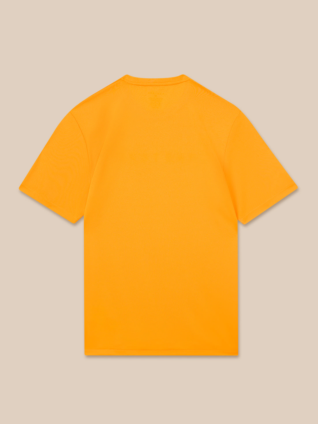 Back view of a bright mango T-shirt against a beige background.