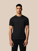 Front view of a man in a black Castore graphic lifestyle T-shirt