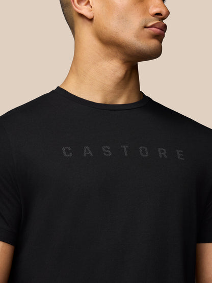 Close up of black T-shirt front showing the Castore graphic across the chest