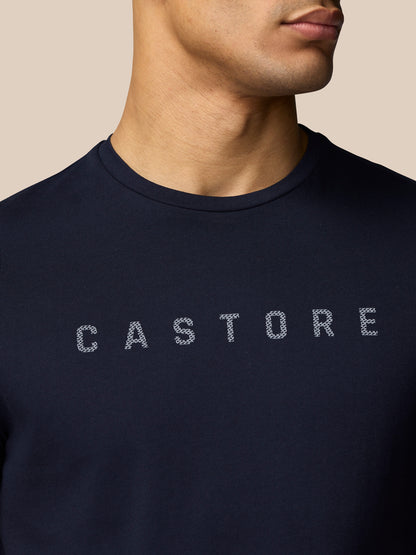 Close-up of navy graphic T shirt chest showing the Castore graphic
