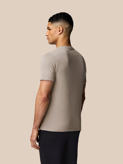 Side profile of a man wearing the Rock Grey graphic lifestyle T shirt.