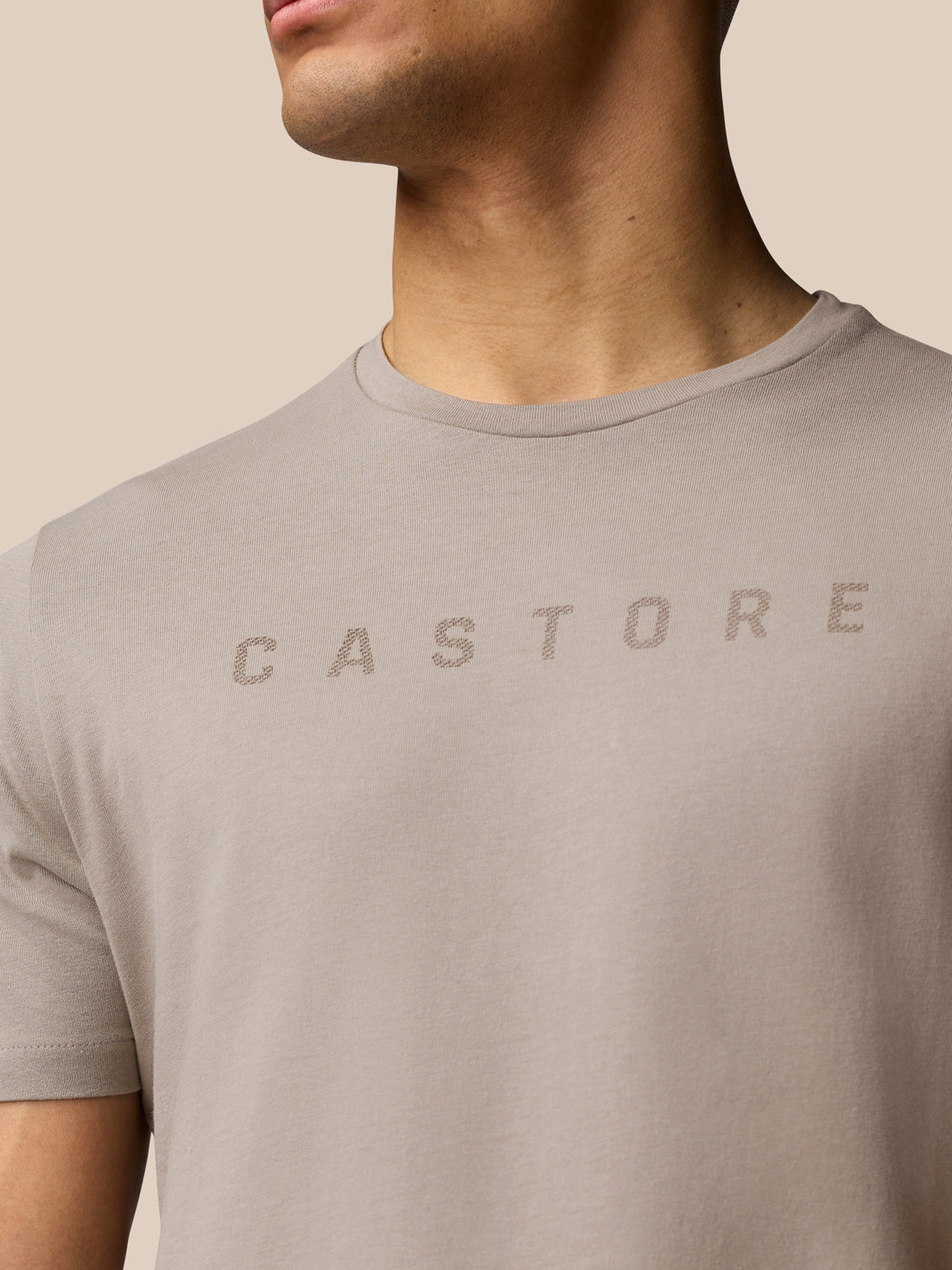 Close up of the Rock Grey graphic lifestyle T shirt showing Castore lettering across the chest.