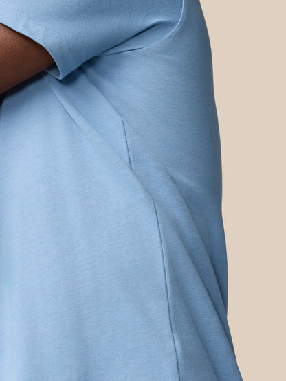 Side view of the sky blue Graphic Training T-Shirt showing the side seam and short sleeve
