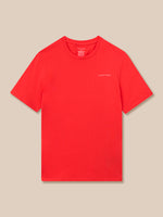 Red Graphic Training T‑shirt laid flat on a tan background with a small white Castore logo on the left chest