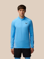 Male model wearing Flow Seamless Quarter Zip Long Sleeve Top in Cool Blue/Black, front view.