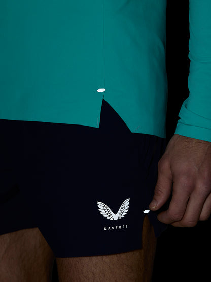 Teal Zone Training top from the hip area with curved hem and small reflective tab