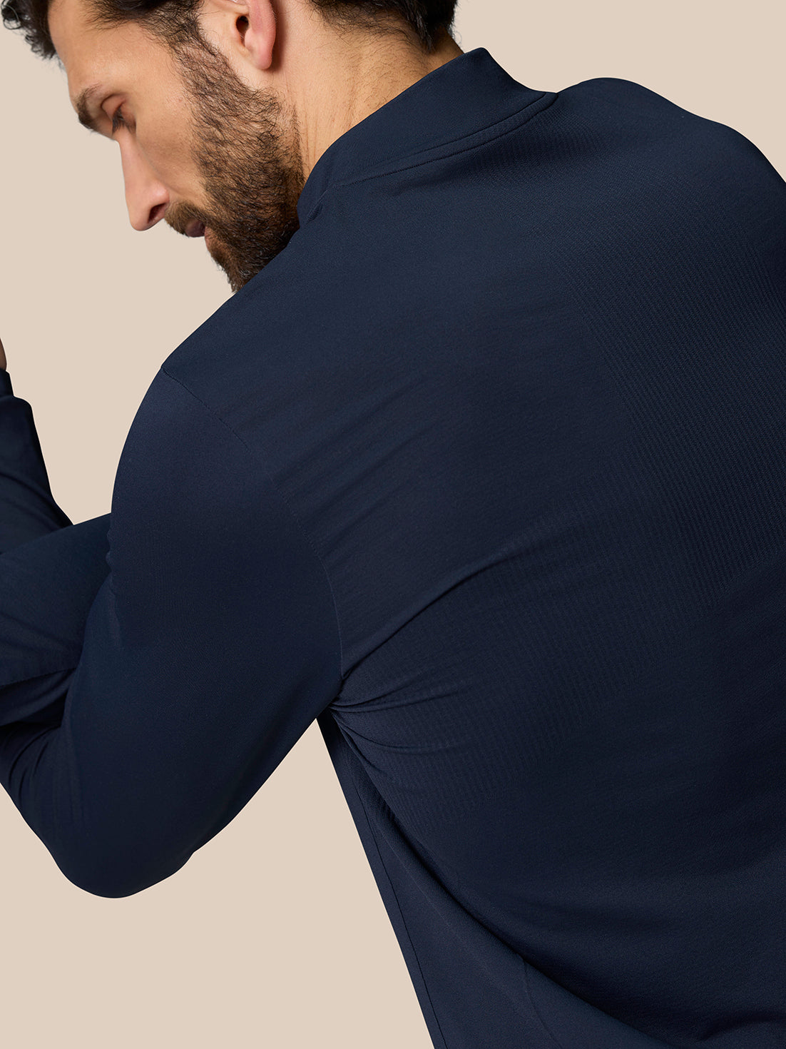 Rear view of Zone Training 1/4 Zip Top in Midnight Navy on a male model, highlighting smooth knit fabric and athletic fit.