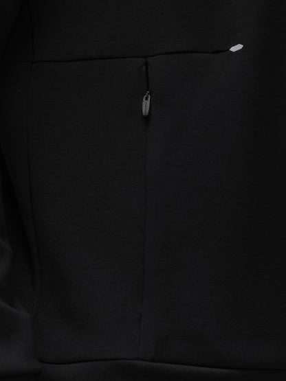 Close-up of black fabric on a Travel Lifestyle Sweatshirt showing a vertical front zip pull along a seam