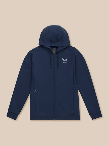 Front view of navy Travel Lifestyle Zip Hoodie laid flat with hood up left chest logo and zip pockets.
