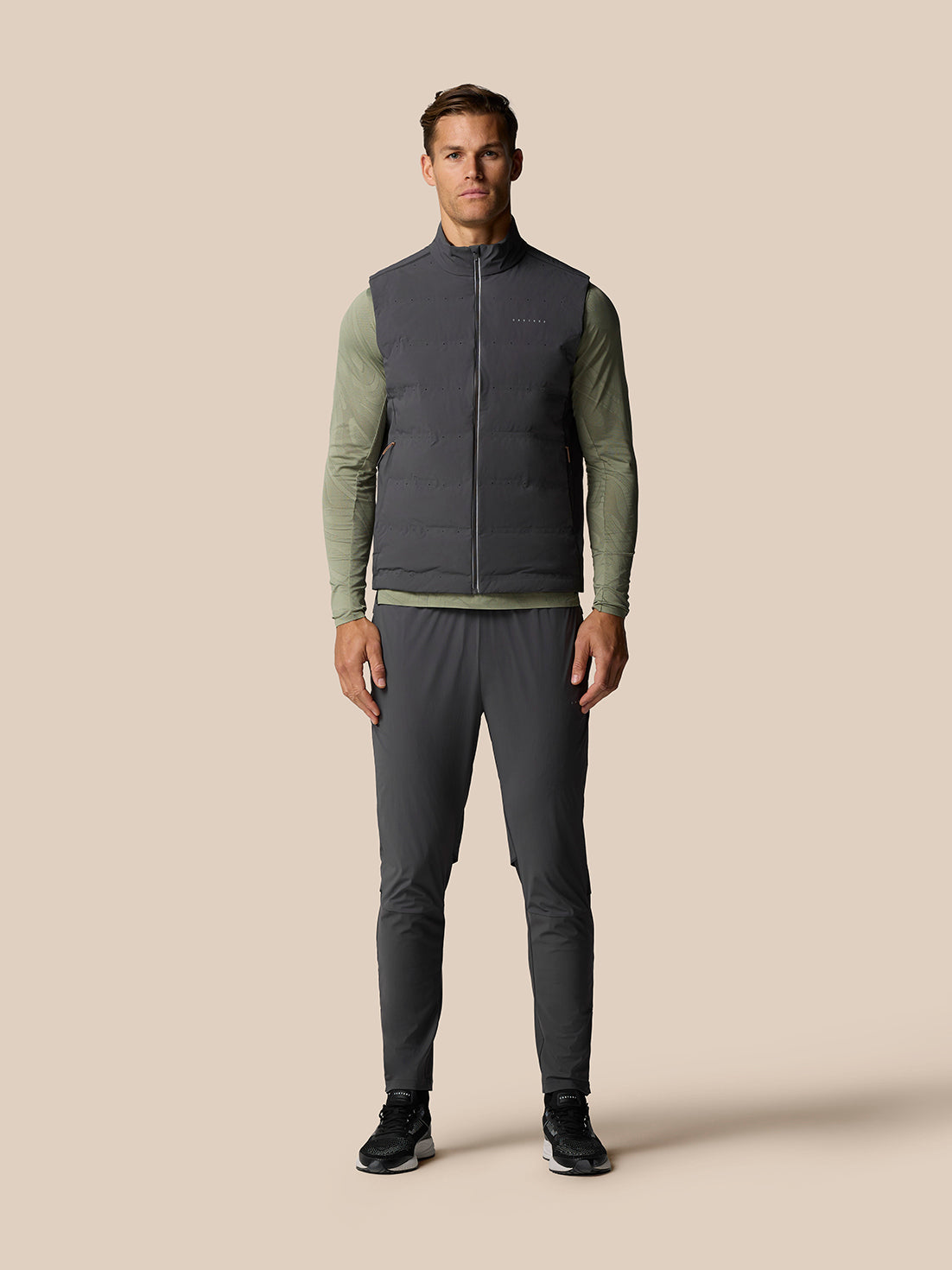 Male model wearing Zone Training LVS Hybrid Pant in Gunmetal Black Reflective