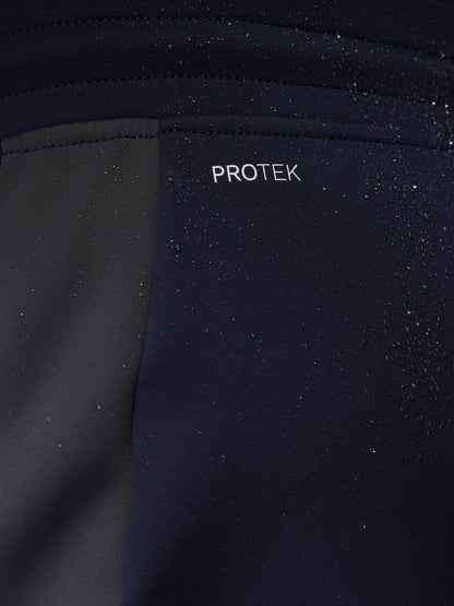 Close-up of navy fabric with water droplets and PROTEK branding.