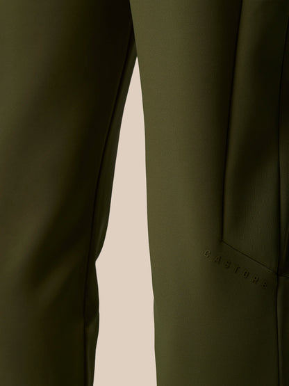 Close-up of the olive green Flex Thermo Pant leg showing a zippered pocket and smooth performance fabric.
