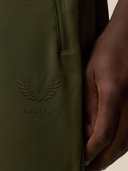 Close-up of the Castore wing logo and branding on the pant leg.