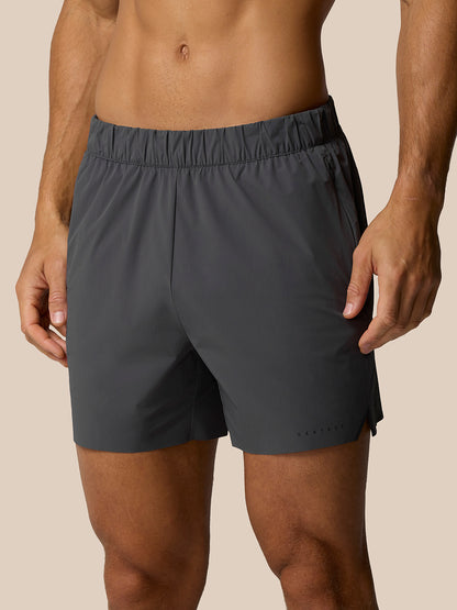Front view of a man wearing Zone Training LVS 5 inch shorts in gunmetal with an elastic waistband