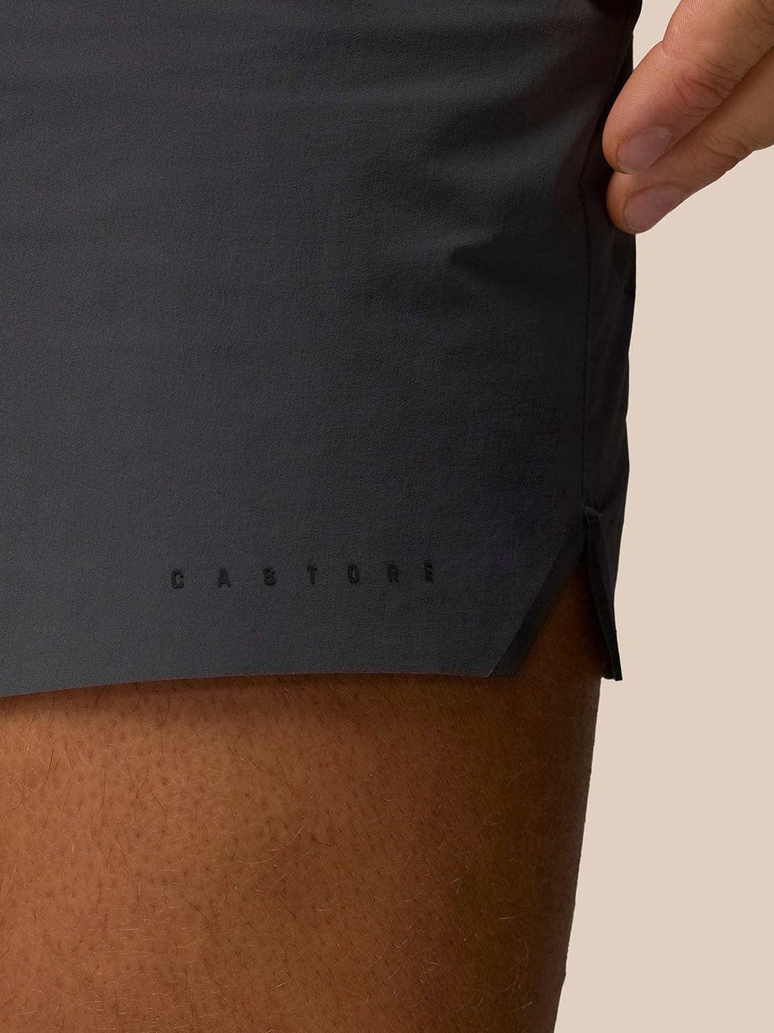 Elastic waistband area of Zone Training LVS shorts with hand adjusting fit and CASTORE logo at the hem