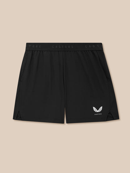 Back view of black Adapt Training shorts with branded waistband and wing logo at the lower right leg