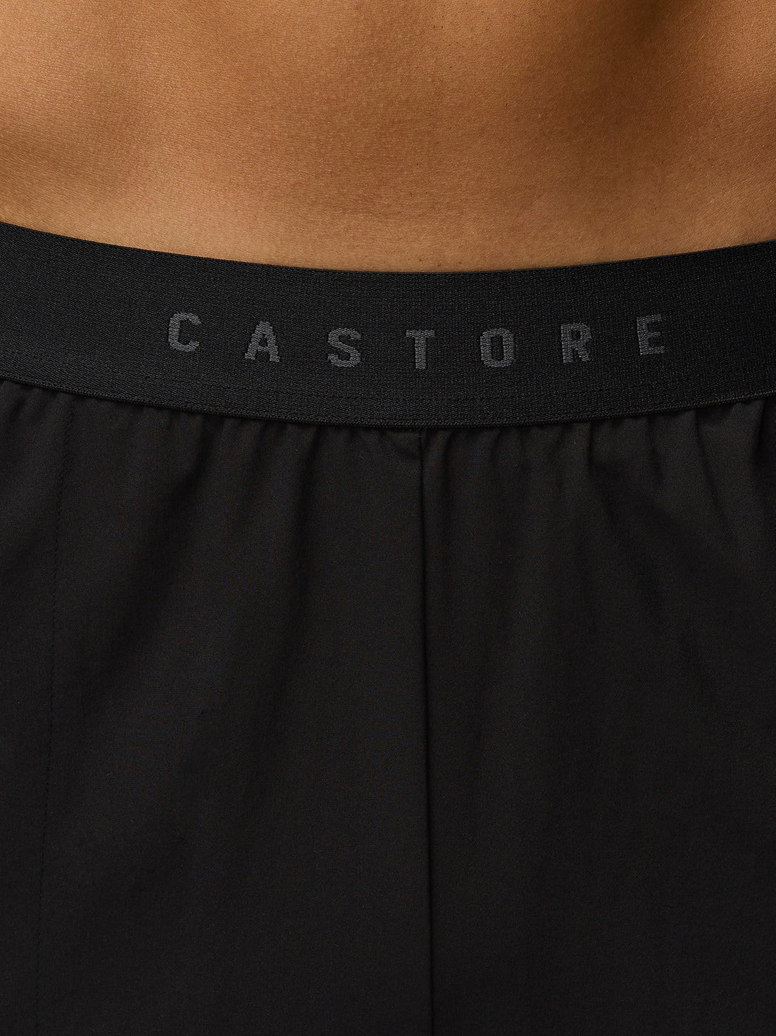 Close up of black Adapt Training shorts waistband with CASTORE branding