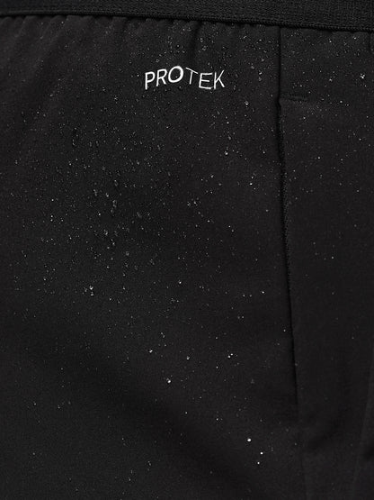 Close-up of black ProTek fabric with water droplets and subtle branding