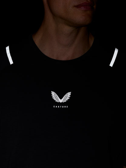Model wearing Apex Training T Shirt with reflective shoulder stripes and Castore branding on the chest