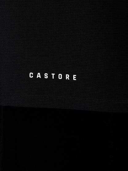 Castore wordmark on the hem of a dark Apex Training T Shirt fabric