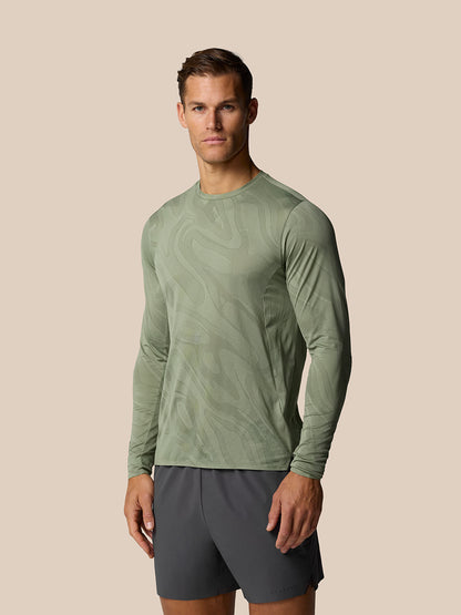 Male model wearing Thyme Zone Training LVS long sleeve top with abstract tonal pattern