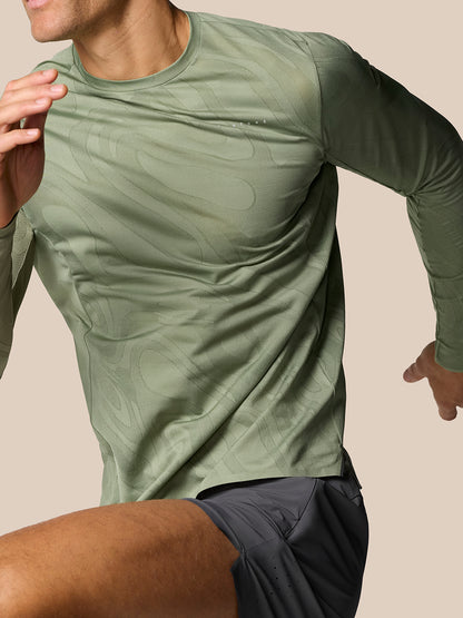 Male model wearing Thyme Zone Training LVS long sleeve top with abstract tonal pattern