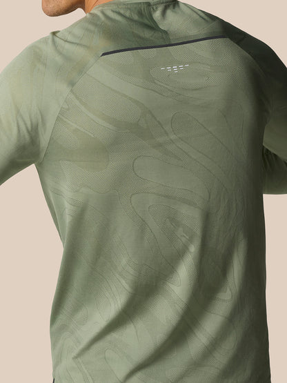 Close-up of the back of Zone Training LVS Long Sleeve Top Thyme highlighting the textured pattern and ventilation accents.