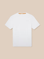 Front view of white Elevated Lifestyle T Shirt laid flat showing left chest Castore logo and orange neck trim