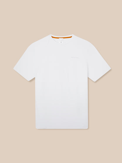 Front view of white Elevated Lifestyle T Shirt laid flat showing left chest Castore logo and orange neck trim