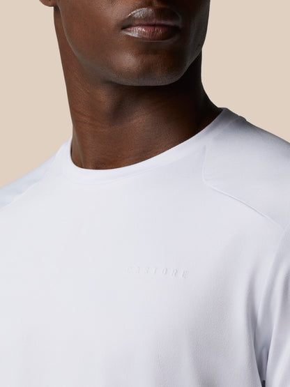 Close-up of white Elevated Lifestyle T-Shirt neckline with subtle embossed Castore logo on chest.