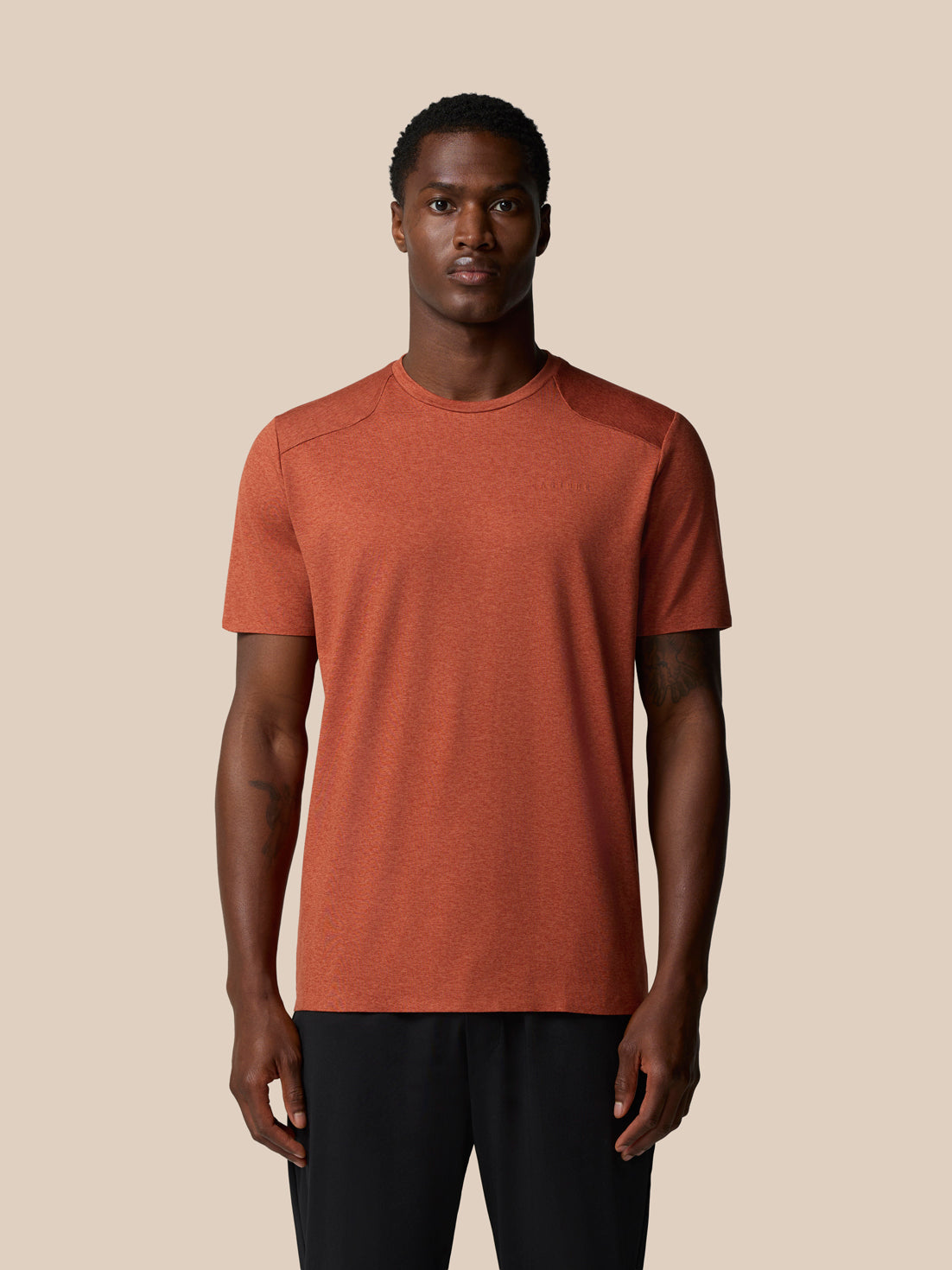 Front view of a male model wearing Dark Rust Elevated Lifestyle T Shirt