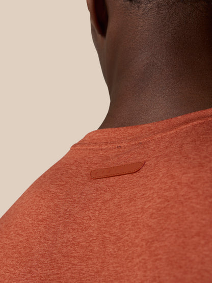 Back view of a Dark Rust Elevated Lifestyle T Shirt with Castore badge on the upper back