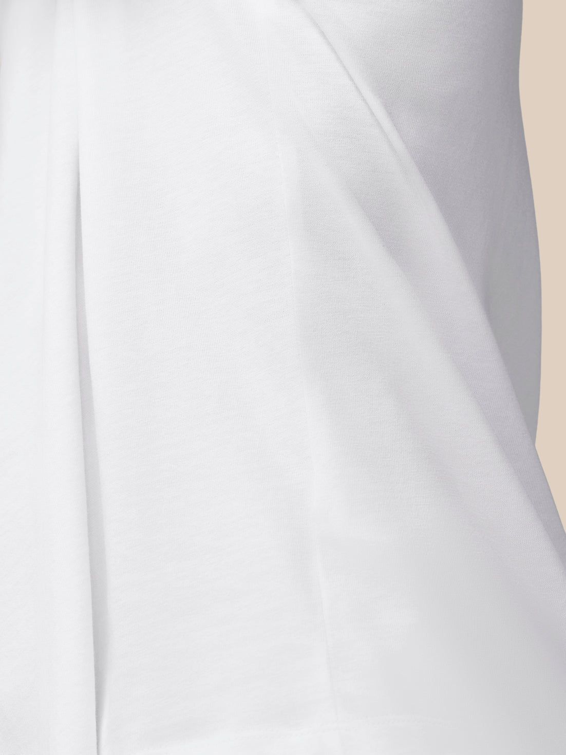 Close-up of white cotton knit fabric with seam detail from the Flex Cotton T shirt White Black