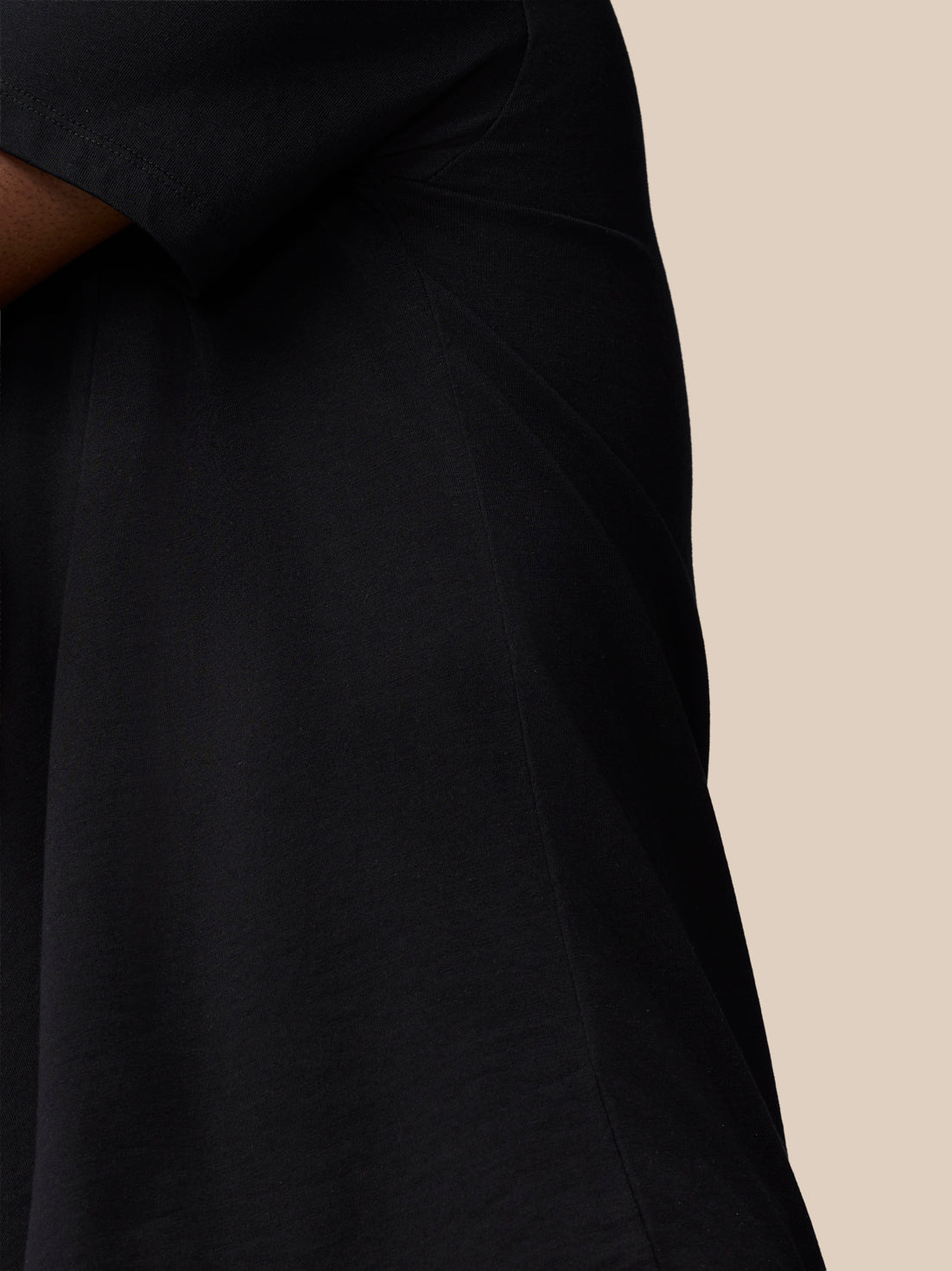 Upper torso view of a black Castore Flex Cotton T-Shirt, showcasing a round neckline and chest logo.