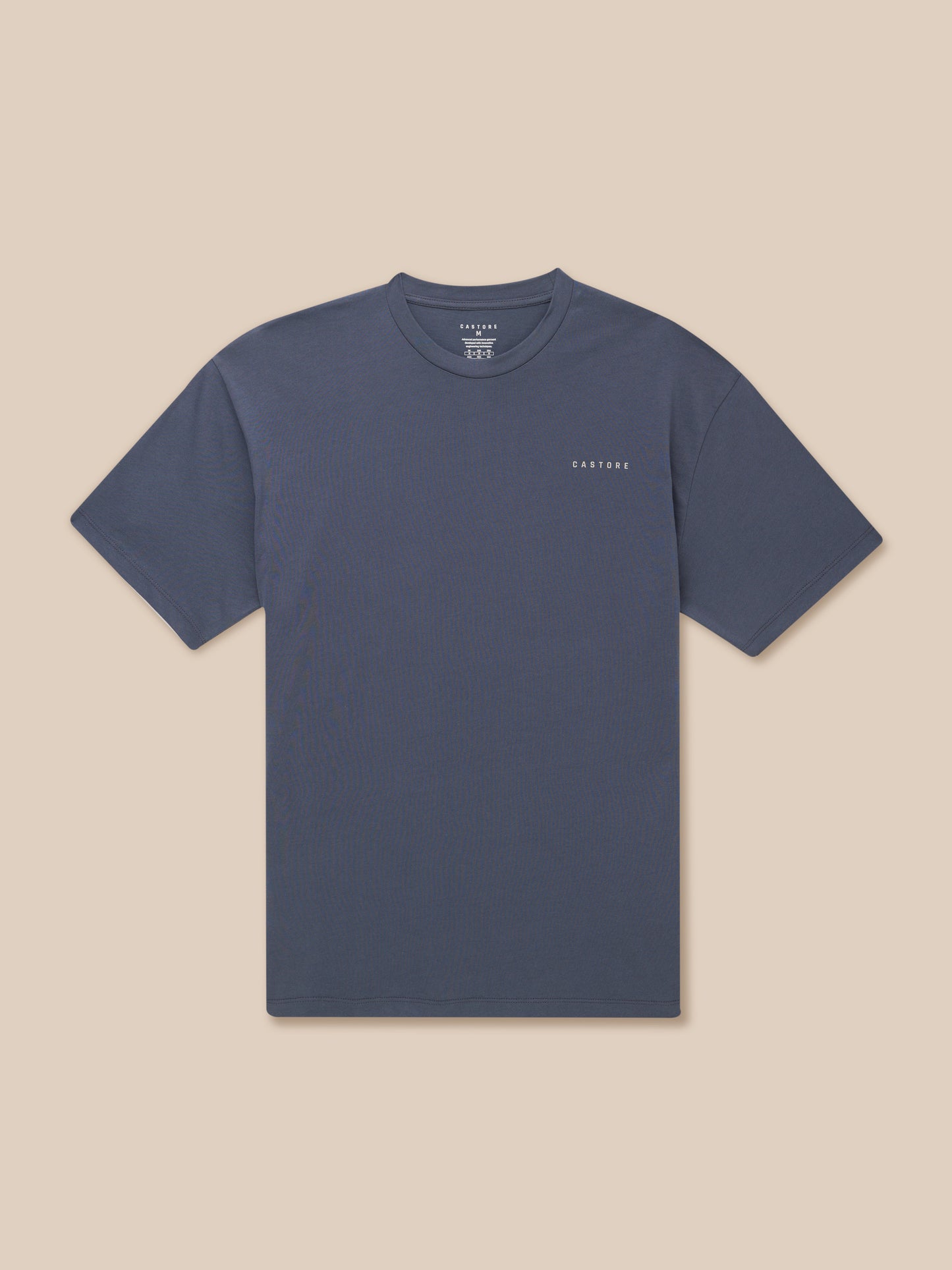 Upper body shot of a pewter blue Flex Cotton T Shirt with a round neckline and a Castore logo on the chest.