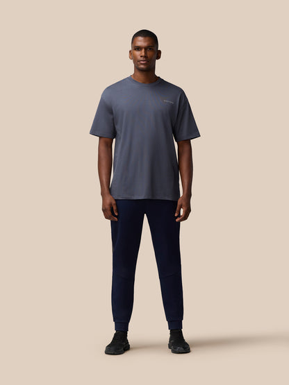 Front view of male model in pewter gray Flex Cotton T Shirt with round neckline and relaxed silhouette.