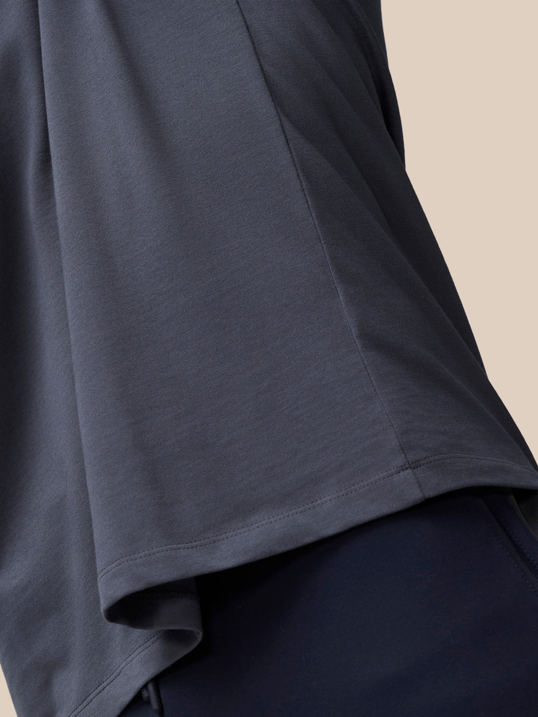 Side view of pewter gray Flex Cotton T-shirt showing draped hem and relaxed fit.