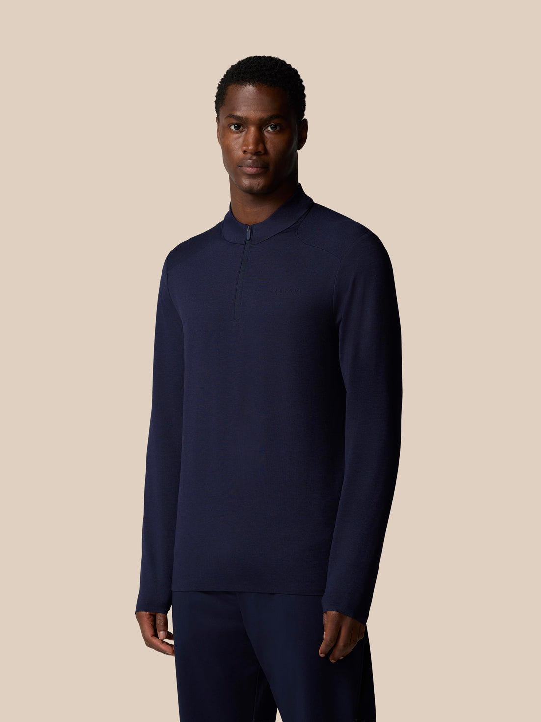 Navy Elevated Lifestyle quarter zip long sleeve top worn by a male model