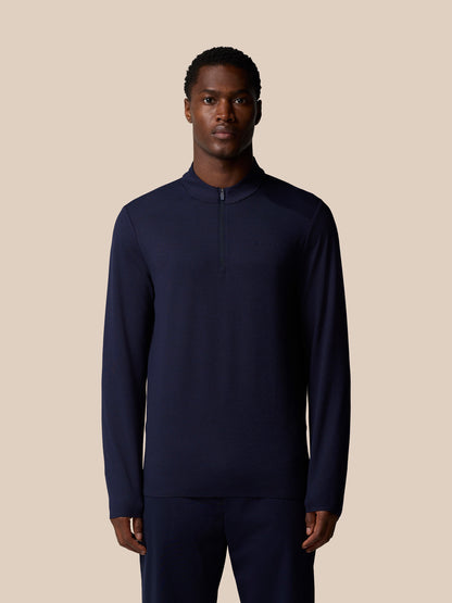 Front view of navy Elevated Lifestyle 1/4 Zip Top on a male model with center front zip