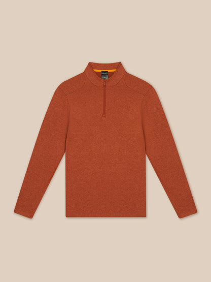 Flat lay shows the dark rust Elevated Lifestyle quarter zip top with a center front zipper on a beige background