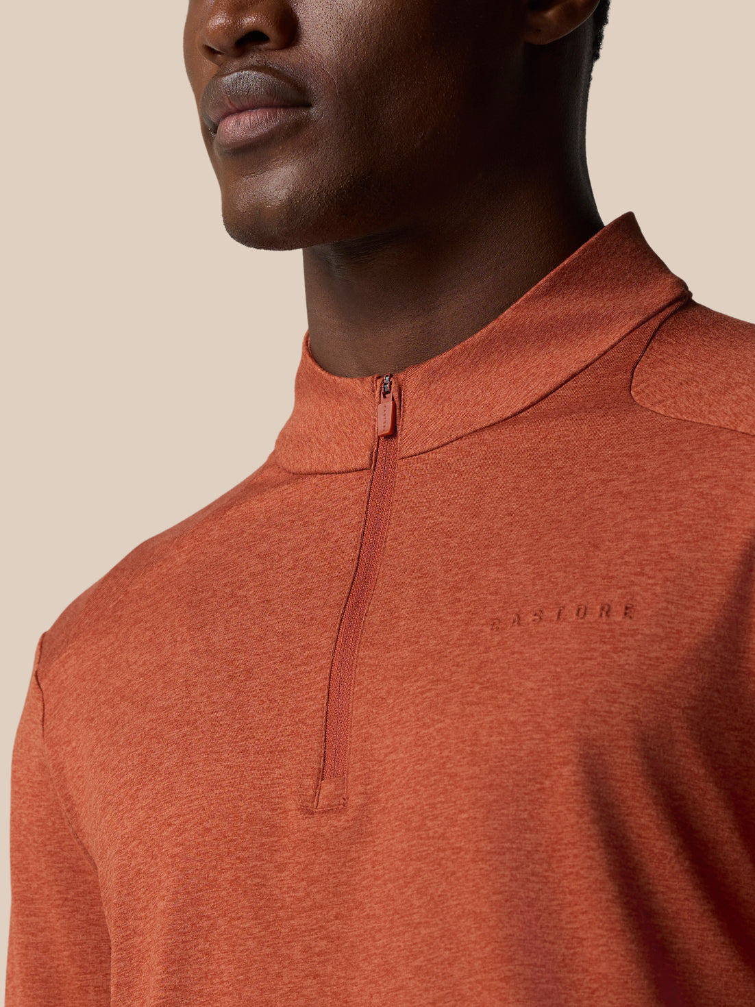 Close-up of Elevated Lifestyle 1/4 Zip Top in dark rust highlighting center front zipper and knit texture