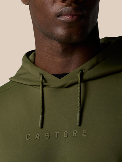 Close-up of olive green Flex Lifestyle Thermo Hoodie showing hood with drawstrings and CASTORE wordmark across the chest