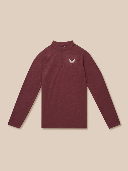 Plum colored quarter zip training top with geometric line pattern and white Castore logo on chest, laid flat.