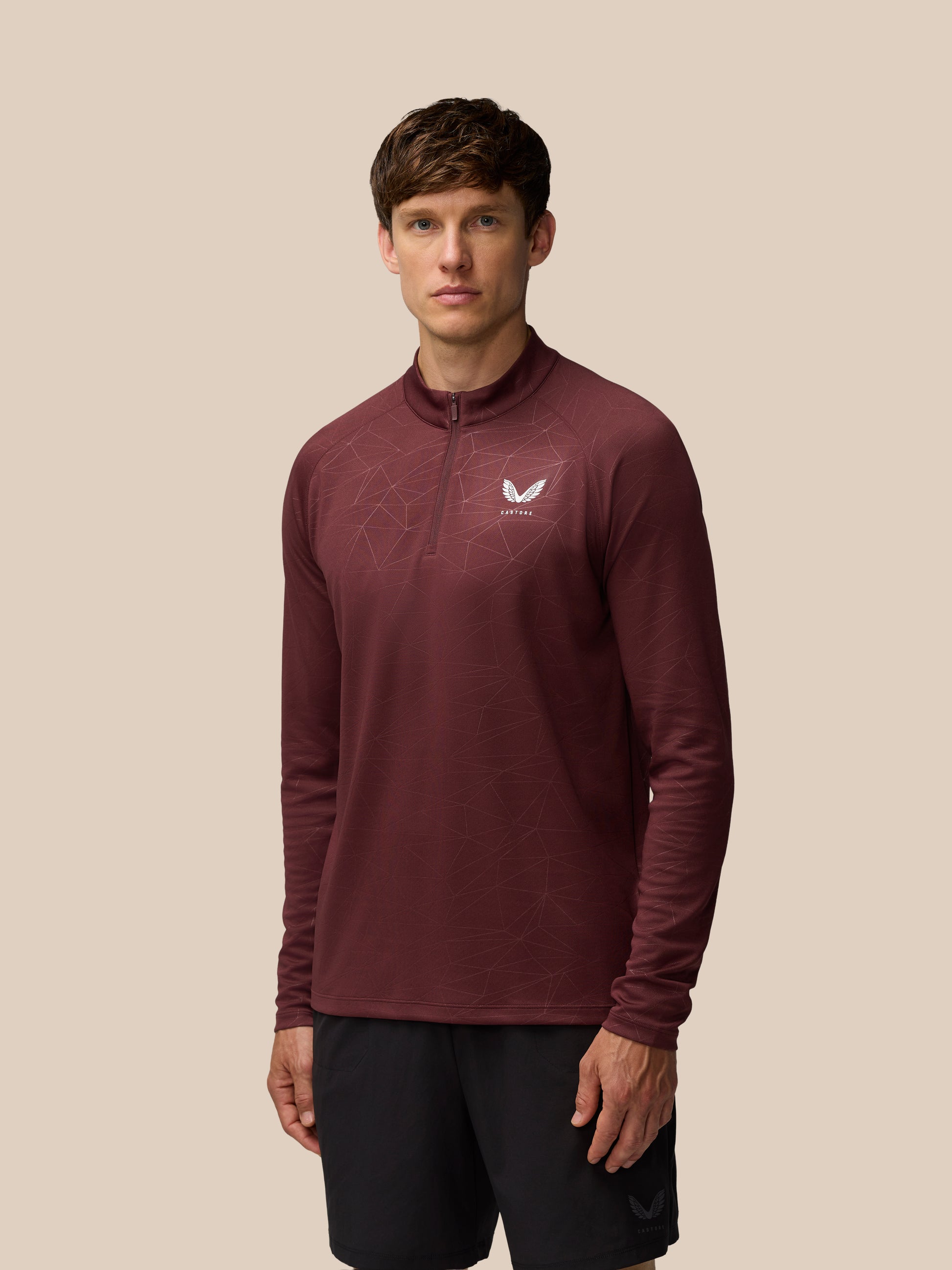 Adapt Training 1/4 Zip Top in Plum Mint with geometric all over print and Castore logo on chest