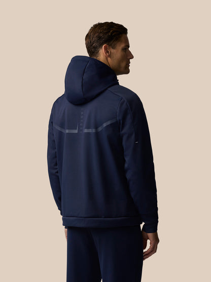Rear view of navy Garcia 3.0 Hoodie on a man with hood up and a reflective back stripe.