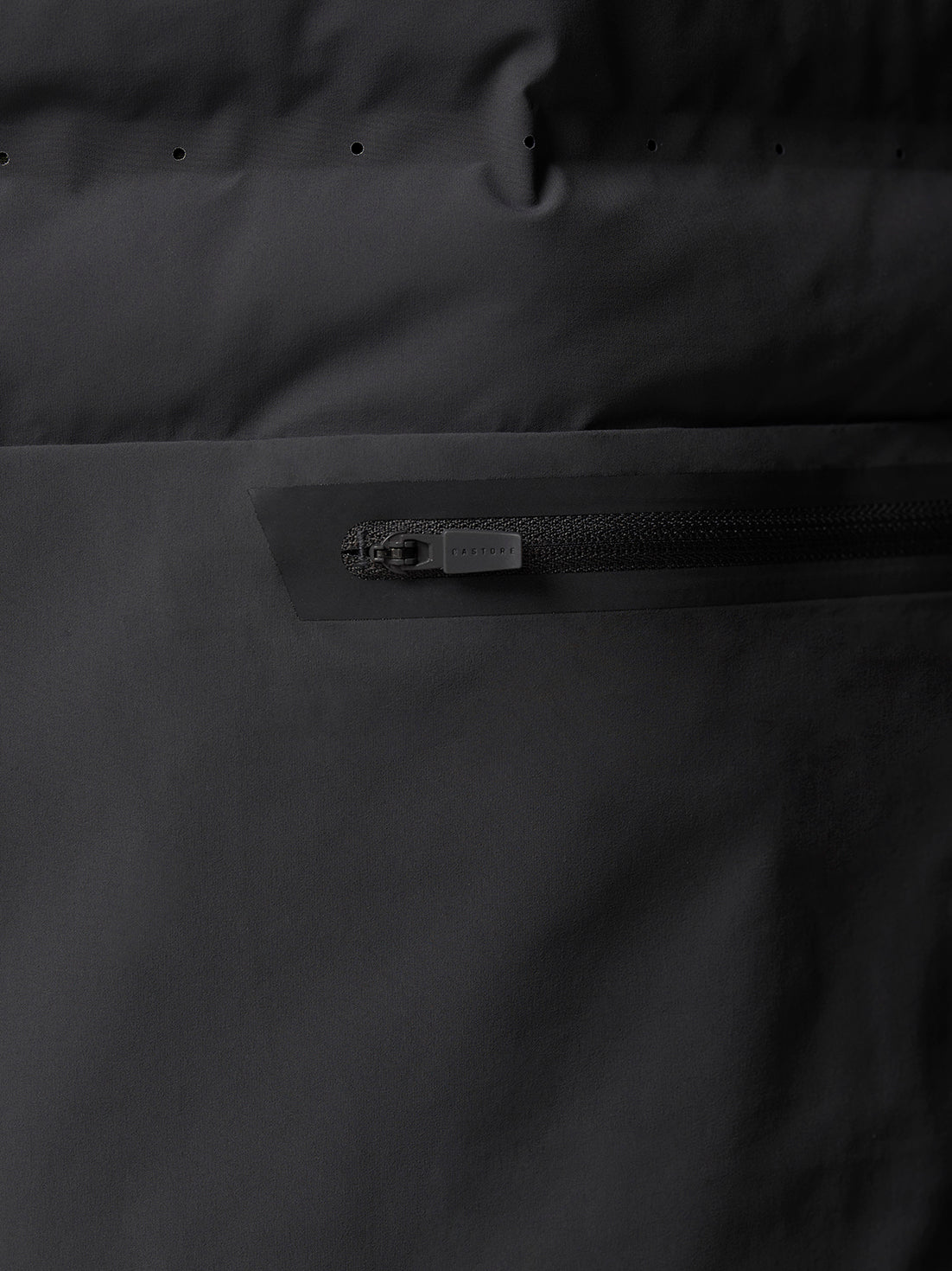 Close up of the back area highlighting a horizontal zippered pocket with a matte pull on the Zone Training LVS Insulated Gilet